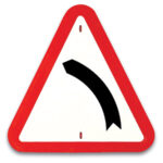 Señal Curva Peligrosa Hacia la Izquierda